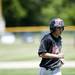 Milan junior Zachary Alliston heads to the dugout after being called out during the game against Richmond on Friday, June 14. Milan lost 3-2. Daniel Brenner I AnnArbor.com